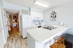 Fridge, microwave, oven, stovetop - Comfortable Gulf-front condo with pool, hot tub, washer dryer, & central AC (Gulf Shores)