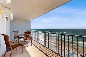Outdoor dining - Beachfront condo with private balcony, outdoor pool, direct beach access & views (Gulf Shores)