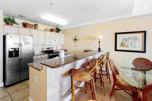 Fridge, microwave, oven, stovetop - Beachfront condo with Gulf view, balcony, pools, hot tubs & gym access (Orange Beach)