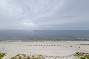 On the beach - Beachfront condo with Gulf views, balcony, pools, hot tubs & sports courts (Orange Beach)