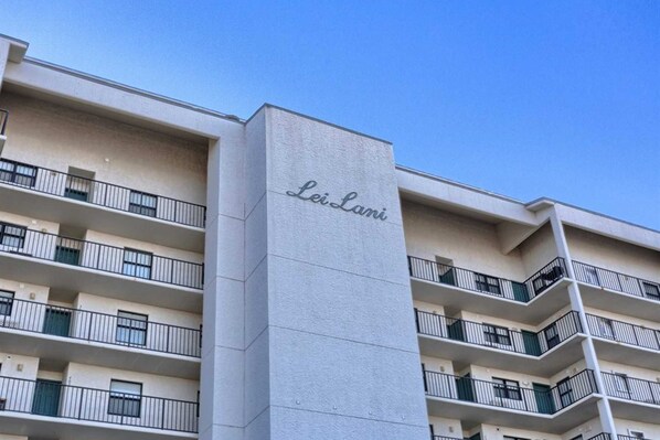 A multi-story building with balconies and a sign reading 'Leilani.' - Gulf-Front Condo with Balcony Overlooking the Beach, AC, WiFi & Shared Pools (Orange Beach)