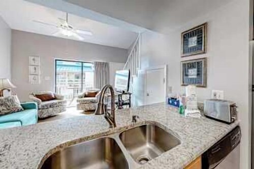 Inviting condo w/ a spacious living area, shared pools, & easy beach access