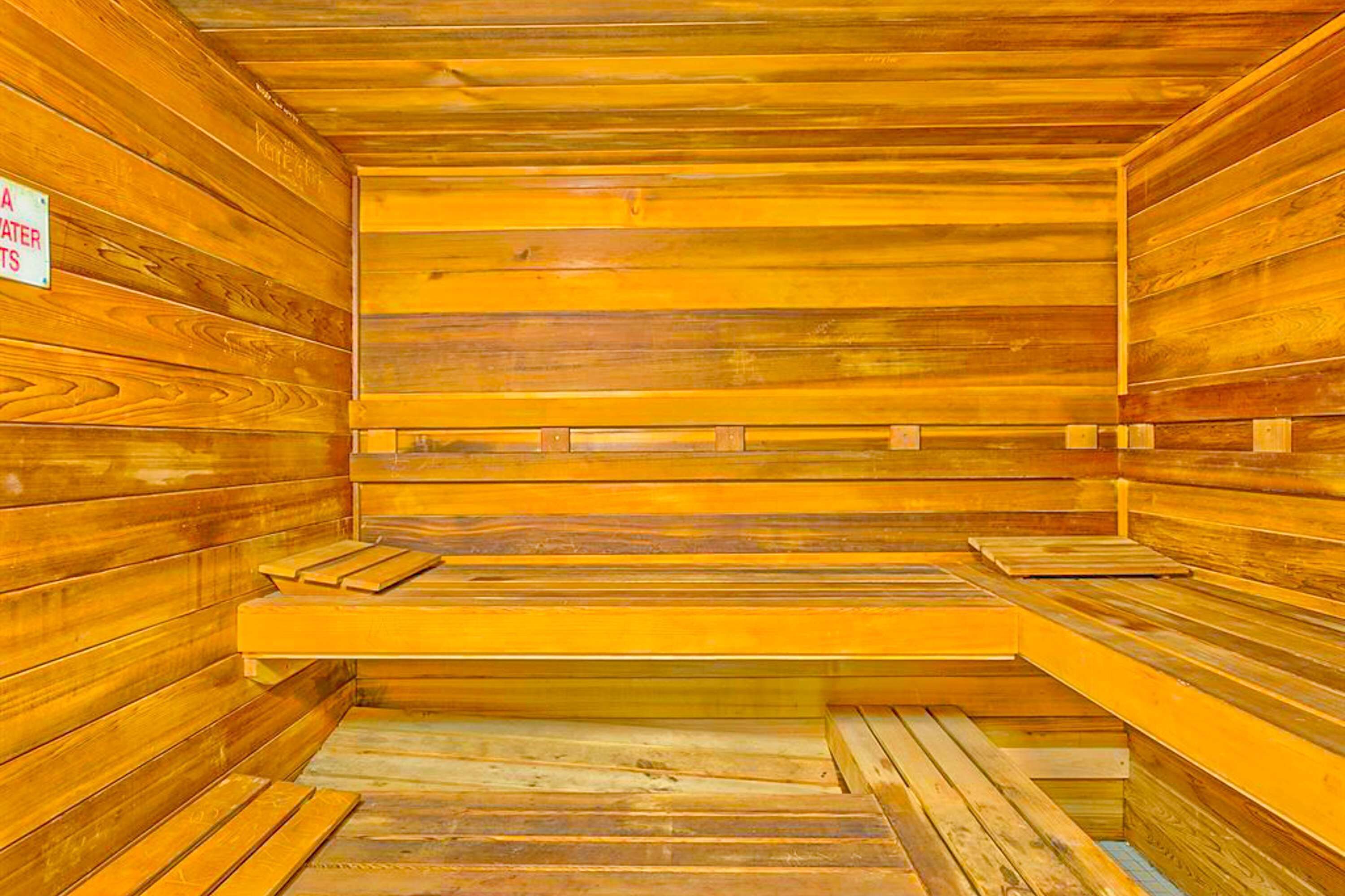 A sauna with wooden walls and benches.