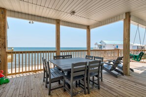 Outdoor dining - Exquisite oceanfront beach home with hot tub, central AC, balcony, & W&D (Dauphin Island)