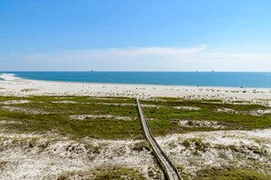 On the beach - Gulf-front condo with a beach view, pools, hot tub, tennis, & fitness room (Dauphin Island)