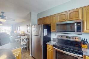 Fridge, microwave, oven, stovetop - Tropically decorated condo in gulf-side complex w/shared pool, central AC, WiFi (Gulf Shores)