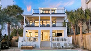 A two-story house with a pool, white railings, and palm trees. - Sandpiper's Retreat|Gulf Front|Private Pool|Golf Cart (Santa Rosa Beach)