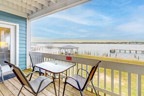 Outdoor dining - Lagoon-front Condo with Shared Pool, Pier, and Beach Access (Gulf Shores)