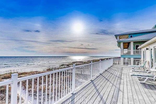 A wooden deck with a railing, overlooking a beach and ocean. - Dog-Friendly & Attractive Beach House w/Private Pool, Free WiFi, Central AC (Gulf Shores)