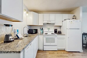 Fridge, microwave, oven, stovetop - Beachview condo with multiple, shared pools, gym, hot tub and beach access (Gulf Shores)