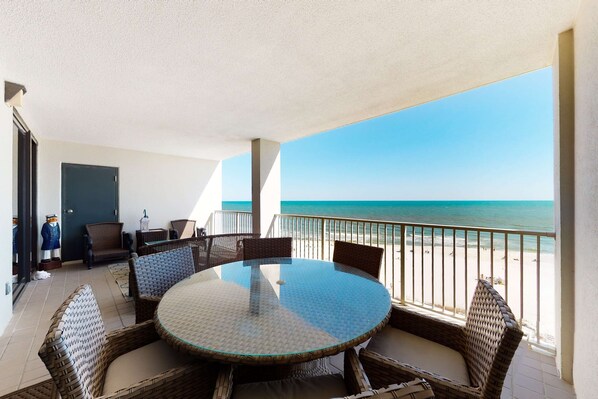 Outdoor dining - Gulf-front condo with shaded deck, AC, pools, hot tub, tennis & Gym (Orange Beach)