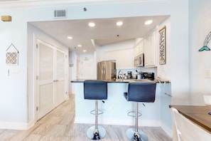 Fridge, microwave, oven, stovetop - Condo in beachfront complex with partial Gulf views, balcony, pools, & gym (Orange Beach)