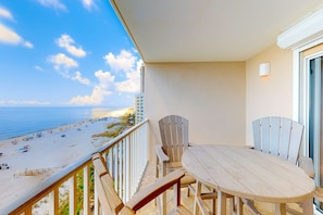Outdoor dining - Gulf-front condo with beach access, private balcony, hot tub, pools & BBQ (Orange Beach)