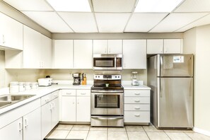 Fridge, microwave, oven, stovetop - Beachfront condo with shared outdoor pool, heated indoor pool, sauna, & grill area (Orange Beach)