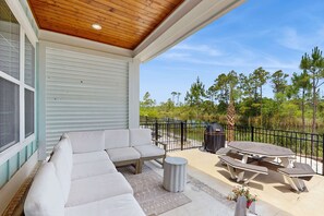Outdoor dining - Modern beach house with porches, private washer and dryer- walk to the beach (Orange Beach)