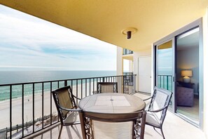 Outdoor dining - Renovated beachfront condo with balcony, central AC, pool, hot tub & tennis (Orange Beach)