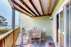 Outdoor dining - Beachfront 2-story condo with beach views, 2 pools, gazebo, balconies, W/D, & AC (Dauphin Island)