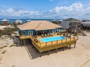 A beachfront house with a pool, wooden deck, and ocean view. - Coastal Gem on the Sand With Large Deck, Ocean Views & Private Pool & Hot Tub (Dauphin Island)