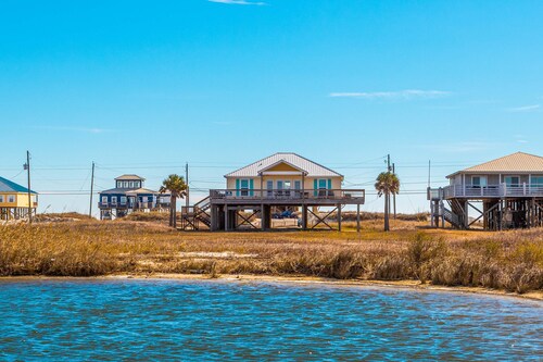 Dog-friendly, water view beach house with a full kitchen, furnished deck, private