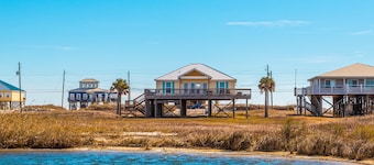 Dog-friendly, water view beach house with a full kitchen, furnished deck, private