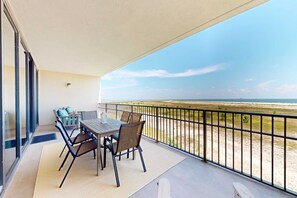Outdoor dining - Beachfront condo with pool, private balcony, and laundry (Dauphin Island)