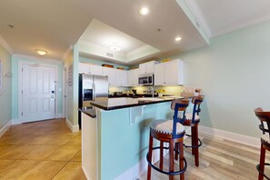 Fridge, microwave, oven, stovetop - Beachfront condo with pool, private balcony, and laundry (Dauphin Island)