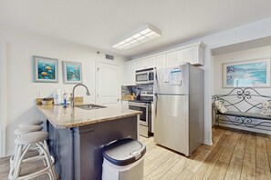 Fridge, microwave, oven, stovetop - Beachfront condo with private balcony, shared pool, and hot tub (Orange Beach)