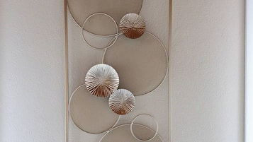 A wall with a series of circular patterns.
