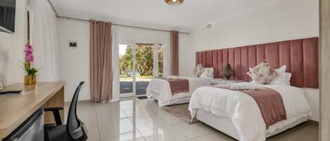 Twin Room, Garden View | Blackout drapes, iron/ironing board, free WiFi