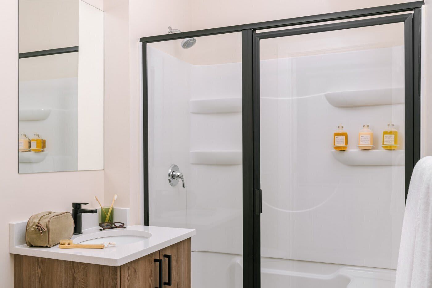 Shower, hair dryer, towels, shampoo