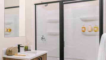 Shower, hair dryer, towels, shampoo