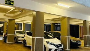 A multi-level parking garage with several cars parked under the structure. - 1Bedroom 1Bath | Perfect for Couples & Business (Nairobi)