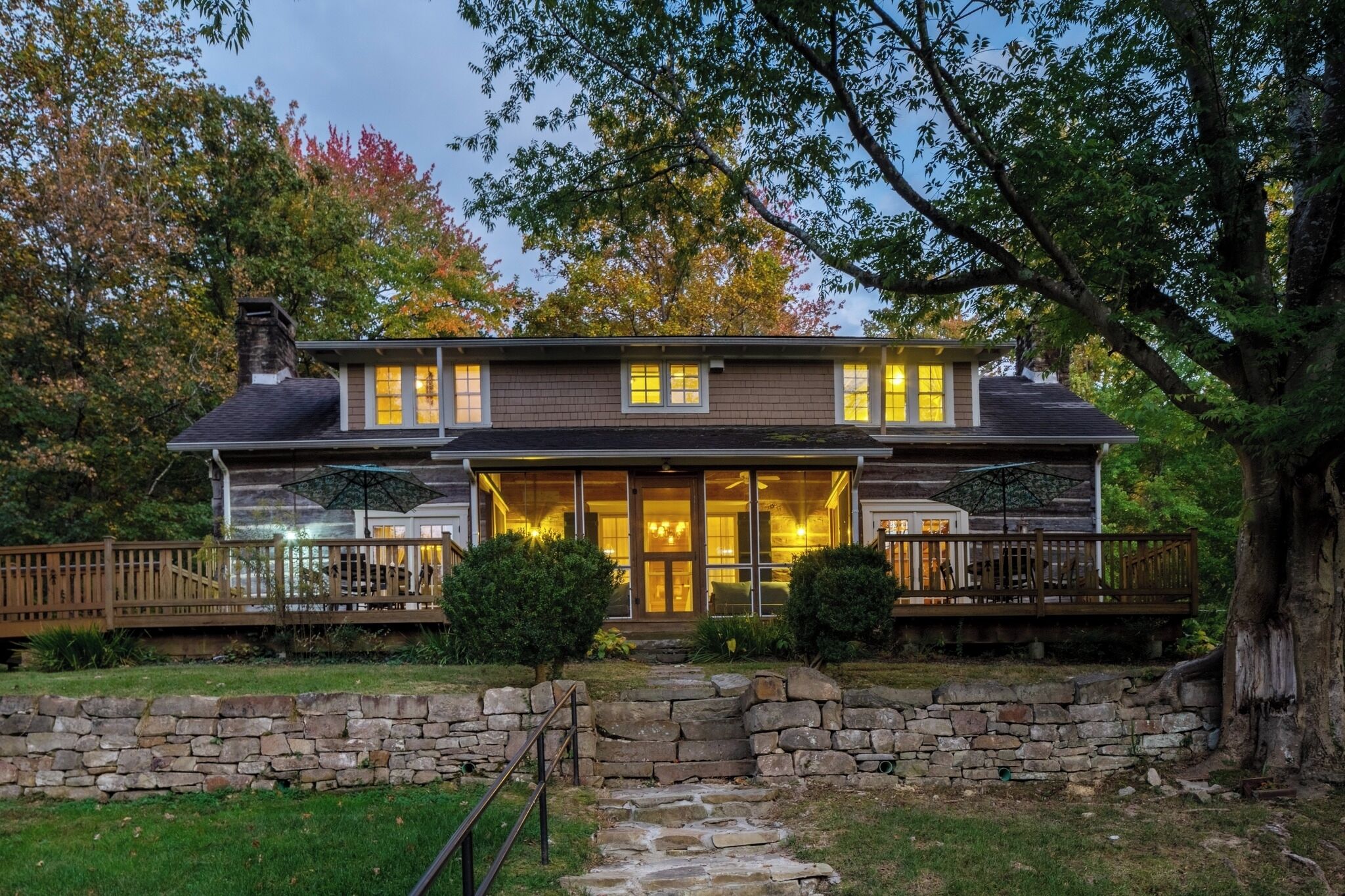 Arrive at dusk to glowing windows and serene decks.