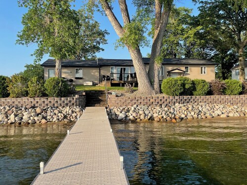 Lake home with beautiful views, private sandy beach, great location.