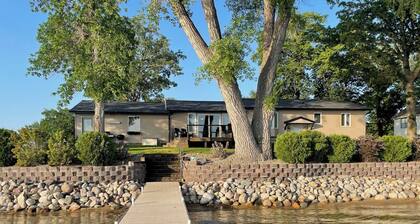 Lake home with beautiful views, private sandy beach, great location.