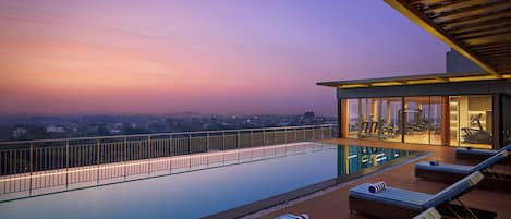 Outdoor pool, open 7:00 AM to 7:00 PM, sun loungers, lifeguards on site