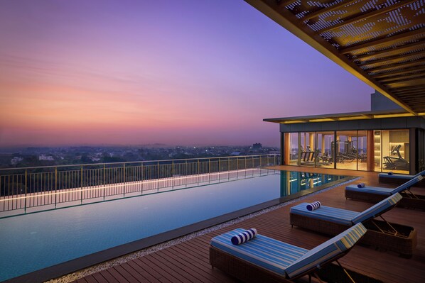 Outdoor pool, open 7:00 AM to 7:00 PM, sun loungers, lifeguards on site