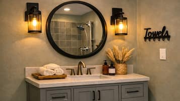 Shower, hair dryer, towels, soap