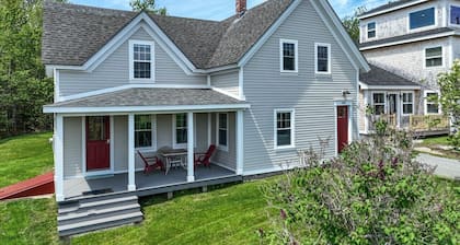 Coastal charm & harbor views just steps from Sand Cove Beach