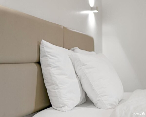 A bed with a beige headboard and white pillows. - Private 4 BDRM house, 5 Miles from Downtown #1 (Indianapolis)