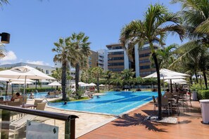 A resort pool area with multiple pools, palm trees, and lounge chairs. - Paraiso do Atlantico #102d - Style by Carpediem (Cabedelo)