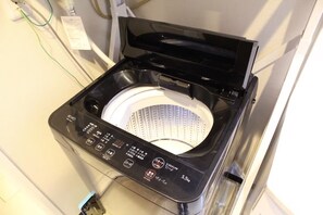 A compact, modern washing machine with a digital control panel, a transparent drum, and a weight capacity indicator of 5.5 kg. - Just a short walk from Kokusai Street Enjoy Okin / Naha City Okinawa (Naha City)