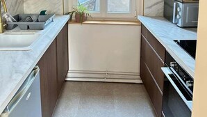A compact kitchen with a window, a sink, a microwave, and cabinets. - Roses, Veules les roses close to the beaches (Veules-les-Roses)