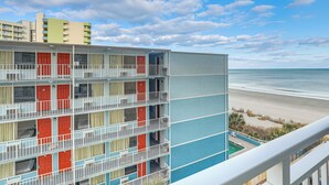 A multi-story hotel with balconies, a pool, and a beach view. - Ocean-View Balcony! Couples Escape in Myrtle Beach (Myrtle Beach)
