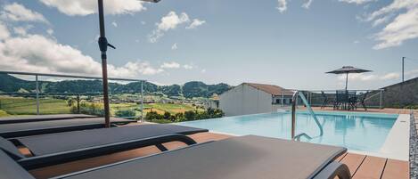 Outdoor pool, open 9:30 AM to 7:30 PM, pool umbrellas, sun loungers