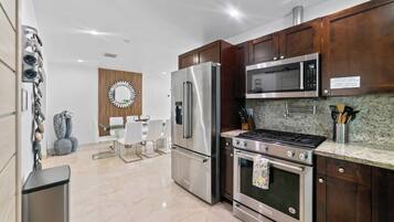 Coffee/tea maker, fridge, microwave, oven