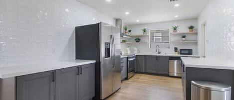 Coffee/tea maker, fridge, microwave, oven