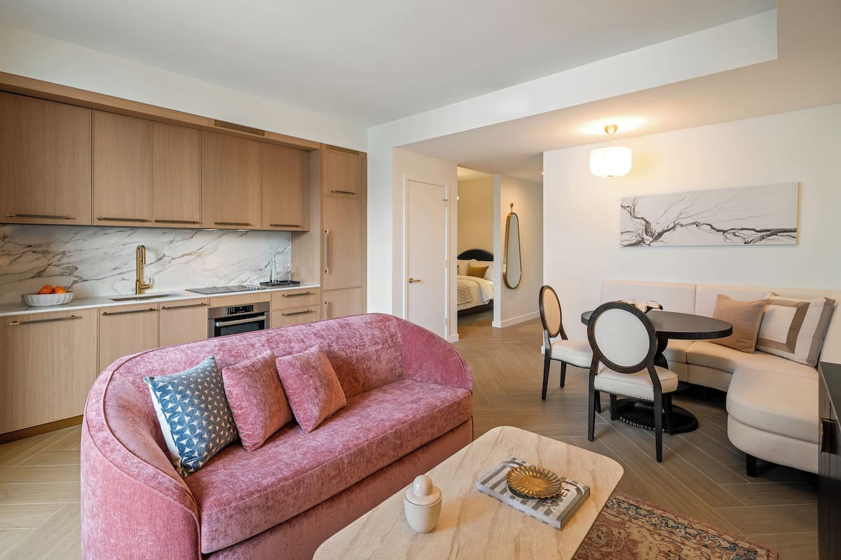 Deluxe Queen Studio | Living area | 55-inch Smart TV with cable channels