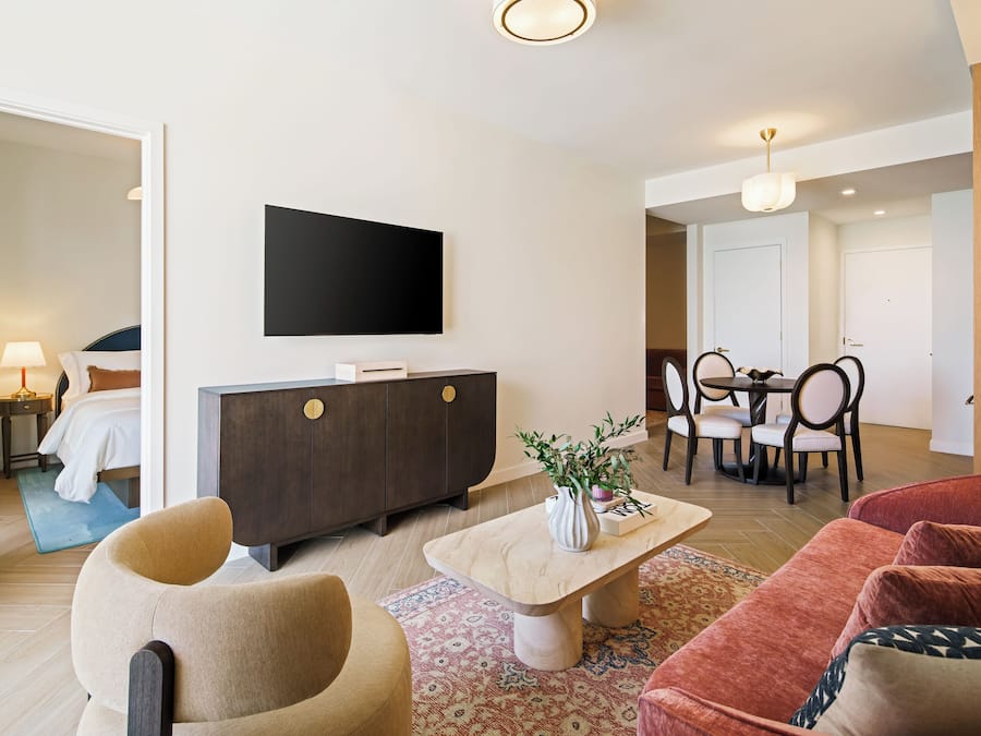 Executive One Bedroom Queen Suite | Living area | 55-inch Smart TV with cable channels