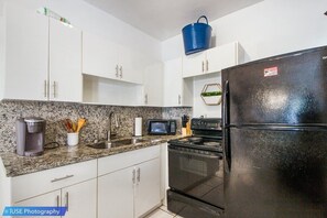 Coffee/tea maker, fridge, microwave, oven
